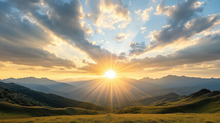 Breathtaking sunrise over mountains with rays of light and clouds