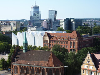 A view of Szczecin city center with two modern buildings, a church and Szczecin Philharmonic Hall © Bluemoment72
