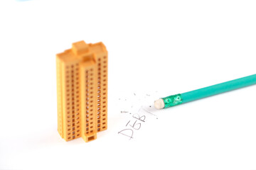 Small house model and pencil eraser erase debt