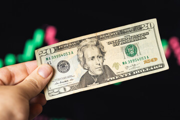 Paying a bill with a twenty dollar bill