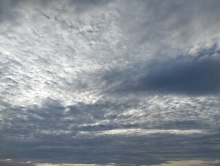 Obraz premium Dramatic dark clouds and blue sky in the morning. Natural background texture 