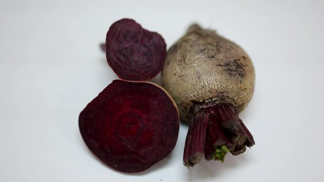 fresh raw beetroot slice close-up studio shot on blurred white background