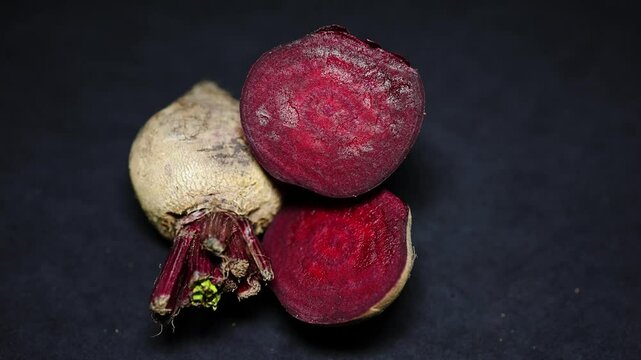 fresh raw beetroot slice close-up studio shot on black background