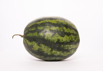 Watermelon Displayed on a Plain Background Highlighting Its Green Striped Rind and Round Shape