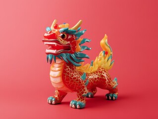 Fototapeta premium A colorful dragon figurine with vibrant details against a red background.
