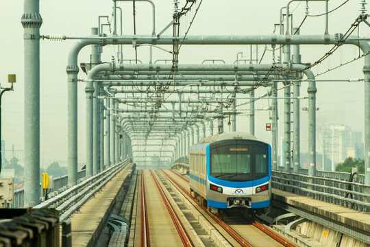 Ho Chi Minh City, Vietnam - December 17, 2024 : Metro Train Moving On Elevated Rail Of The Metro Line No.1 In Ho Chi Minh City.
