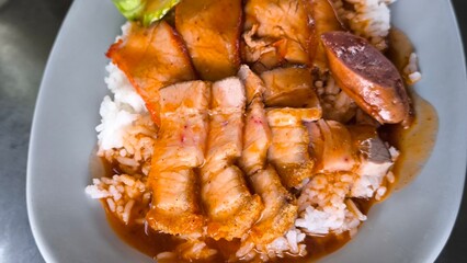 Red pork and crispy pork on rice, food in Thailand