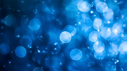 An abstract blue background enhanced by bokeh effects.