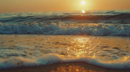 Naklejka premium Closeup seaside sand reflecting orange and golden sunset skies, panoramic beach horizon, calm tropical seascape with tranquil summer vibes for relaxing holiday travel