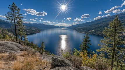 Naklejka premium Serene Lake Landscape Under Bright Sunlight with Reflections