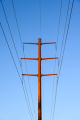 Closeup of upgraded to 230 kV overhead power line distribution system, high-tension power lines on...