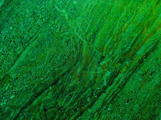 abstract close-up texture of stone with green color stain grunge texture background