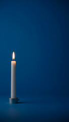 Capture the essence of solitude with a lone candle on a deep blue background, evoking a sense of calm and reflection, studio lighting, with white tones