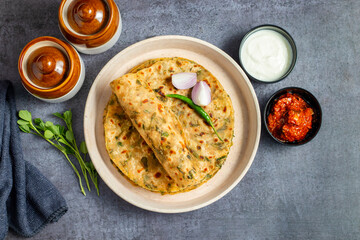 Methi paratha is a savory Indian flatbread made with fenugreek leaves, whole wheat flour, spices,...