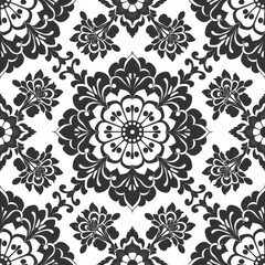 A black and white floral pattern with intricate designs and symmetrical motifs.