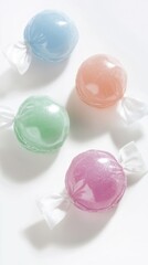 Obraz premium Four Vibrant Pastel Candies in Elegant Wraps