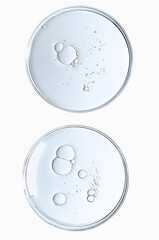 The texture of a cosmetic serum or body gel in a Petri dish.