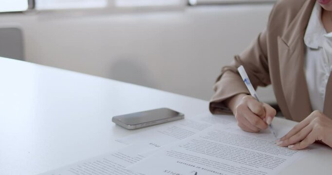 A person scans documents using a smartphone for easy digital storage.