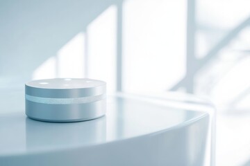A sleek, cylindrical smart speaker rests on a minimalist white surface, bathed in soft light.
