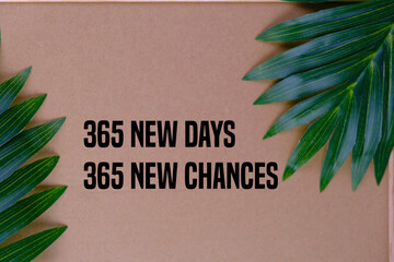 365 new days, 365 new chances. Letter board with motivational quote on brown frame background with leaves. New year resolutions and goal setting, self improvement and development concept.
