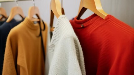 colorful clothes hanging on hangers.  generative ai 
