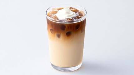 Iced coffee drink with cream and layered colors in a glass.