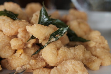 Crispy dori fish cooked with salted egg and curry leaf seasoning