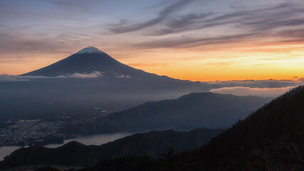 Beautiful sunset aerial view of Mount Fuji and Lake Kawaguchi with colorful sky and city, Yamanashi, Japan