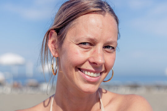Smiling woman looking directly at the camera.