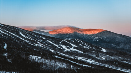 Alpenglow on Crocker Mountain, Maine in winter.