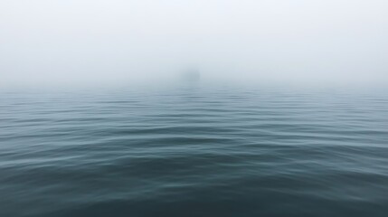 Fototapeta premium Foggy Seascape with a Distant Silhouette