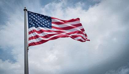Obraz premium American flag waving against cloudy sky
