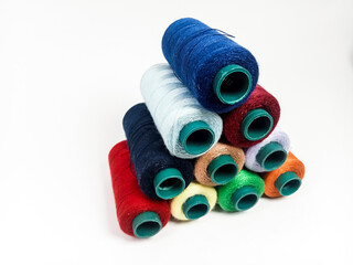 fabric thread assorted colors, rolls of thread assorted colors, isolated on white background
