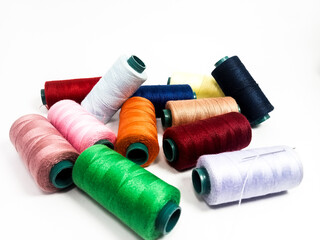 nylon sewing thread in roll form, various colors of sewing thread isolated on white background, suitable for textile industry product catalog design