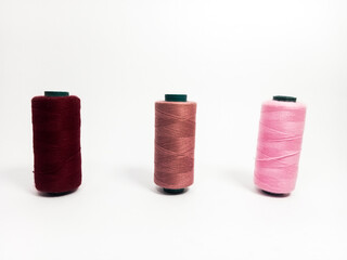 nylon sewing thread in roll form, various colors of sewing thread isolated on white background, suitable for textile industry product catalog design