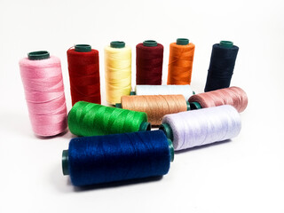 nylon sewing thread in roll form, various colors of sewing thread isolated on white background, suitable for textile industry product catalog design