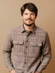 Obraz premium Professional engineer standing in studio, smiling confidently with hands in pockets, radiating workplace competence and approachability