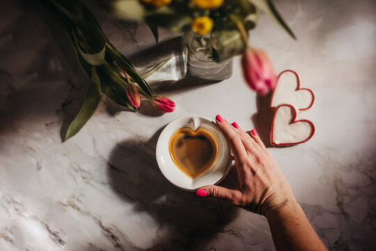 Heart shaped cookies with flowers and coffee