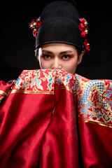 Young woman wearing Ming Dynasty Feiyu clothing on black background