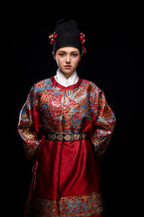 Young woman wearing Ming Dynasty Feiyu clothing on black background