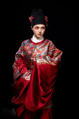 Young woman wearing Ming Dynasty Feiyu clothing on black background