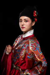 Young woman wearing Ming Dynasty Feiyu clothing on black background