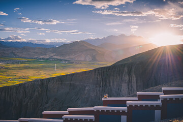 Sunset over the rapeseed fields around Sakya monastery, Western Tibet
