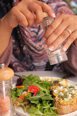 Savoring a Fresh, Flavorful Salad Highlighted with Appetizing Seasoning