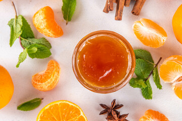 Golden sweet homemade tangerine jam, with spices and mint