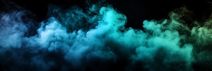 Fototapeta premium abstract cloud of blue and green smoke on a black background