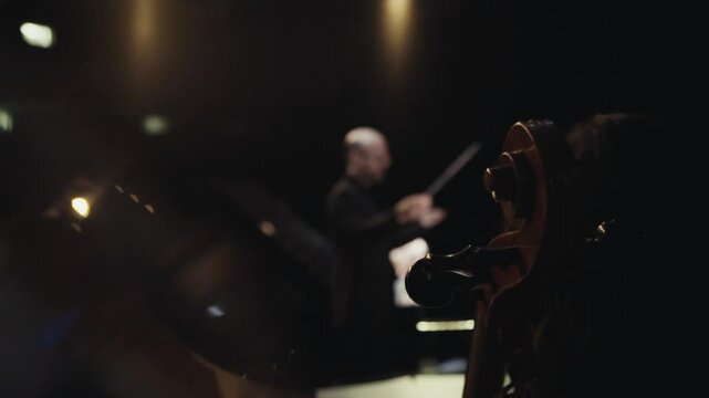 Unrecognizable male symphony orchestra conductor. Slow motion