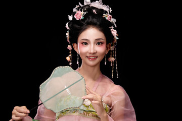 Seated woman wearing Tang Dynasty hairpin flower lady's dress and holding a light fan