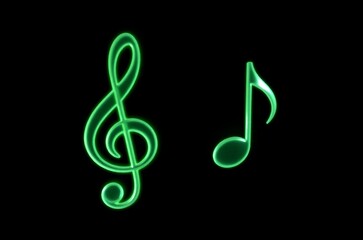 Fototapeta premium a close up of a green light painting of music notes