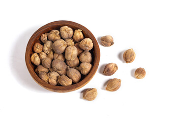 A bunch of cardamom (kapulaga) seeds isolated on a white background. In addition to being a flavor enhancer, cardamom is also used as a medicine for coughs, itchy throats, stomach aches, bloating.